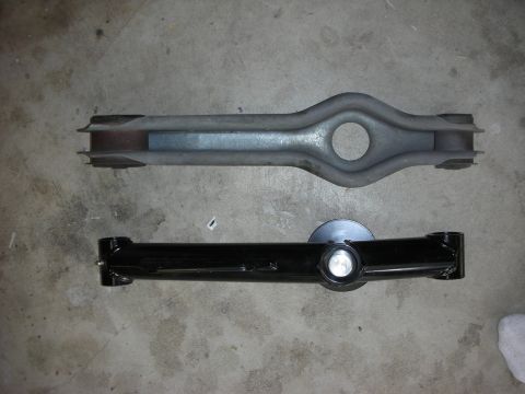 1990 Ford Mustang - Comparison of an old and a newly painted suspension control arm, likely for a vehicle rebuild.