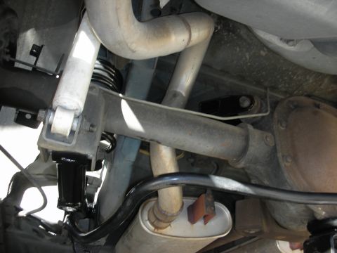 1990 Ford Mustang - Underside view of the rear suspension and exhaust system on a 1990 Ford Mustang.