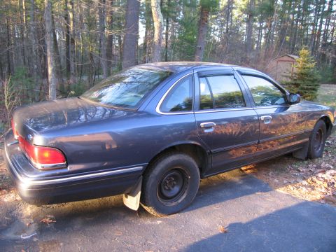 1991 Ford LTD Crown Victoria - Side view of a 1991 Ford Crown Victoria LTD sedan parked on a driveway.