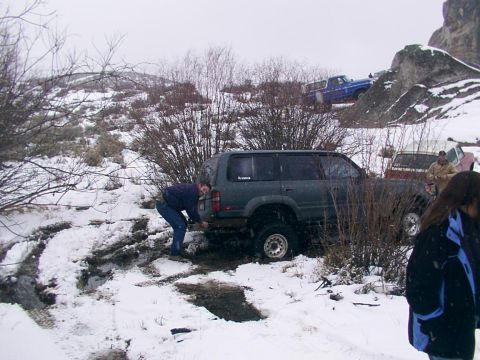 2003 Ford Ranger - Off-road vehicles stuck in snow during a winter excursion.