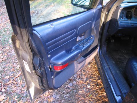 1991 Ford LTD Crown Victoria - Interior view of a 1991 Ford Crown Victoria LTD showing the driver's side door panel.