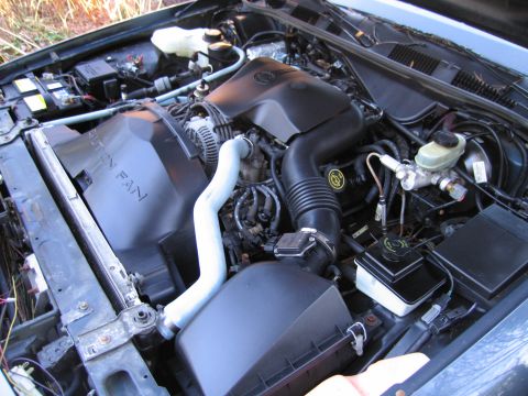 1991 Ford LTD Crown Victoria - Engine bay of a 1991 Ford Crown Victoria LTD, showing the V8 engine components and cooling system.