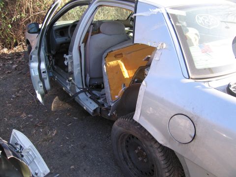 1991 Ford LTD Crown Victoria - This 1991 Ford Crown Victoria LTD shows significant damage to its interior and exterior panels.