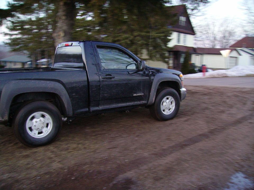 Dark blue pickup truck, side view