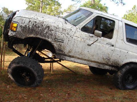 1989 Ford Bronco - This lifted 1989 Ford Bronco is heavily coated in mud, its off-road capabilities.