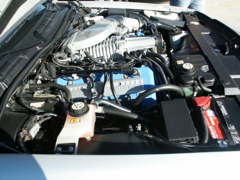 2001 Mercury Grand Marquis - Close-up view of a supercharged V8 engine bay, showing various components and wiring.