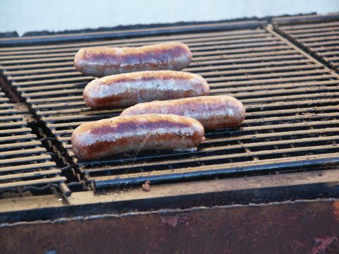2001 Mercury Grand Marquis - Sausages cooking on a grill.
