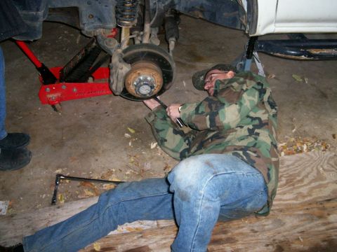 1993 Ford Bronco - Keith loosening the four lower ball joint bolts