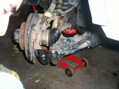1993 Ford Bronco - New lower ball joint fastened onto knuckle/spindle with tie rod end bolted up to it
