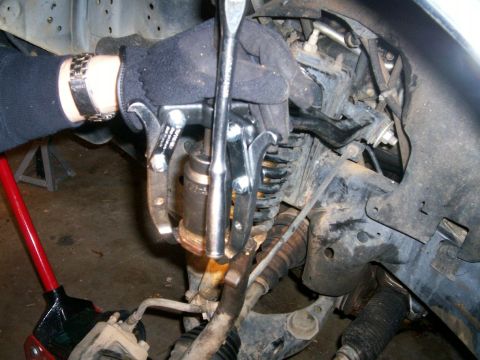 1993 Ford Bronco - Three jaw puller and 36 mm socket pressing out upper ball joint from knuckle/spindle