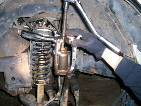 1993 Ford Bronco - Another shot of three jaw puller and 36 mm socket pressing out upper ball joint. A small bolt was placed in the socket hole in order to use…