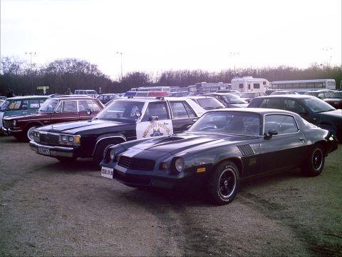 1991 Ford Crown Victoria - with a 1974 Camaro at the meeting point