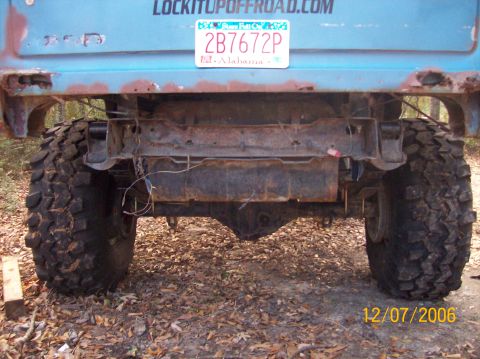 1978 Ford Bronco - Rear view of a blue truck with off-road tires and a visible license plate.