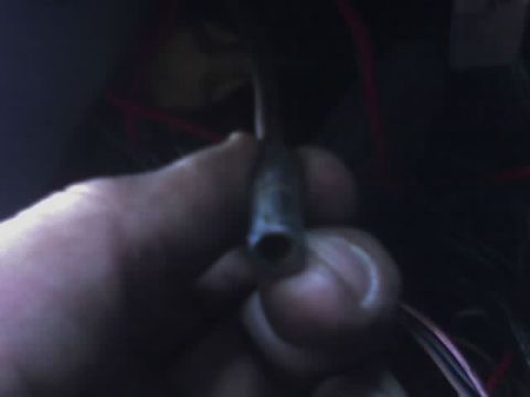 1978 Ford Bronco - A hand is shown holding an electrical connector with visible wires in the background.