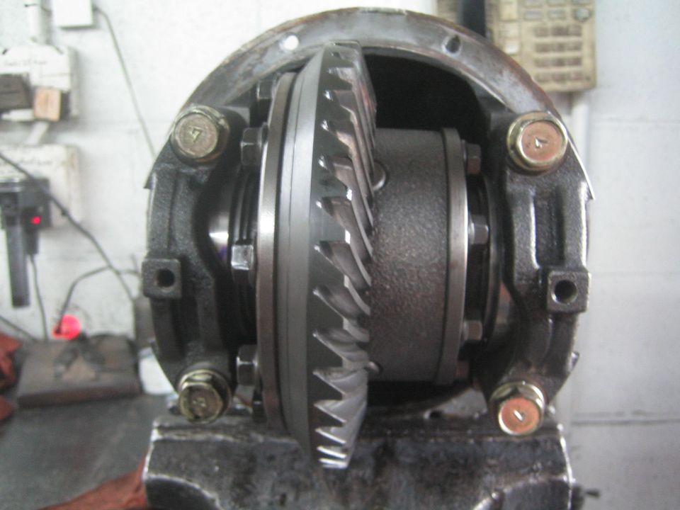 Close-up of a differential housing with visible gears and bolts