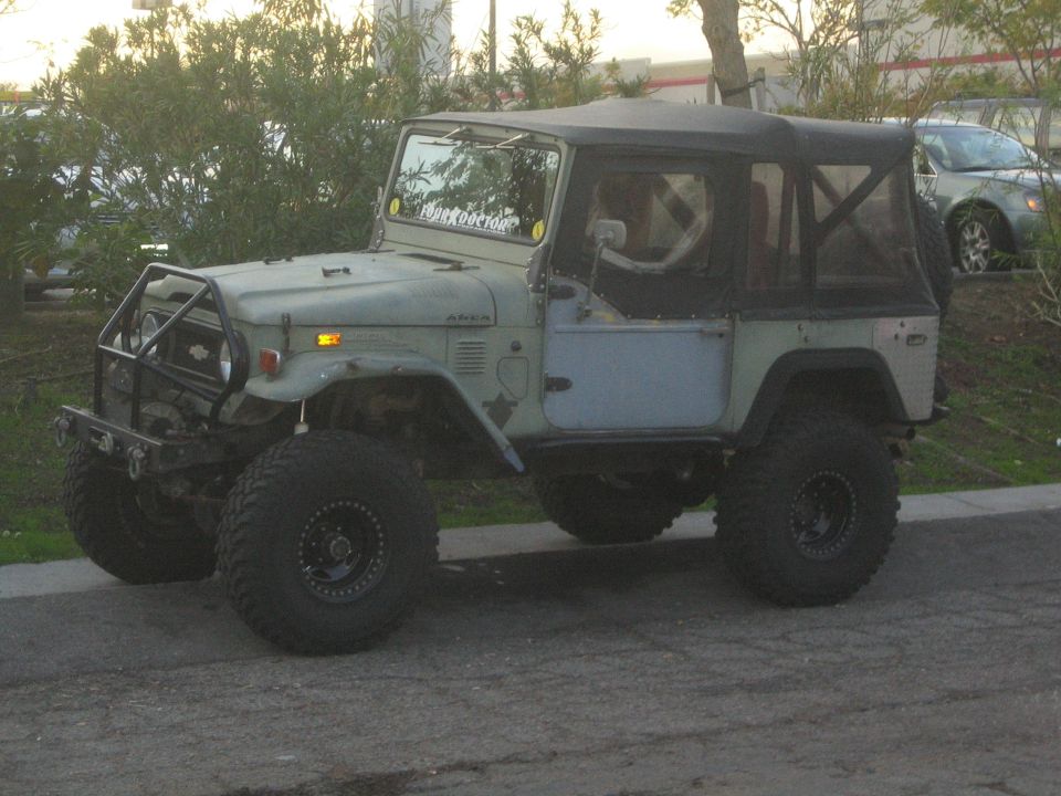 Lifted Toyota Land Cruiser FJ40 with aftermarket bumper and soft top