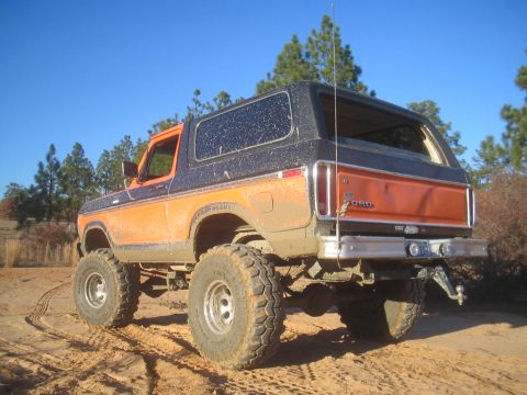 1979 Ford Bronco - This lifted 1978 Ford Bronco is shown off-road, covered in mud.