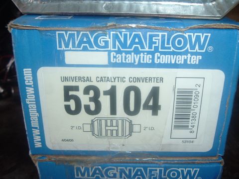 1989 Ford Escort - A box for a Magnaflow universal catalytic converter is shown, with product details and a barcode.