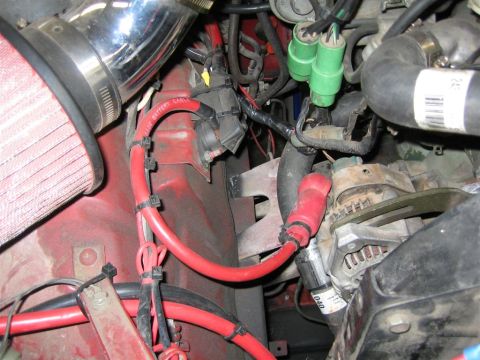 1987 Suzuki Samurai - The engine bay shows a complex network of red battery cables and electrical wiring, with some green connectors visible.