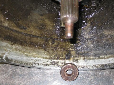 1987 Suzuki Samurai - Close-up view of a dirty transmission component, including a splined shaft and a bearing.