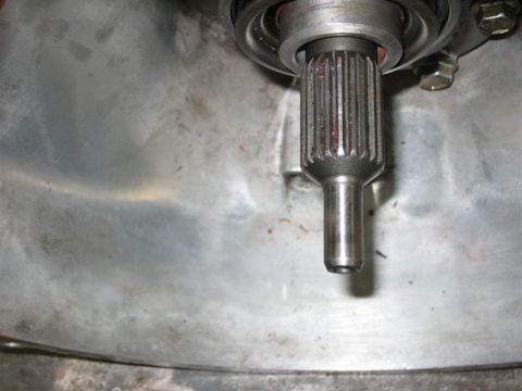1987 Suzuki Samurai - Close-up view of a transmission input shaft, showing its splined end and bearing assembly.