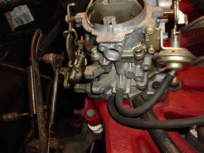 1971 Dodge Dart - Close-up view of a carburetor and associated engine components.