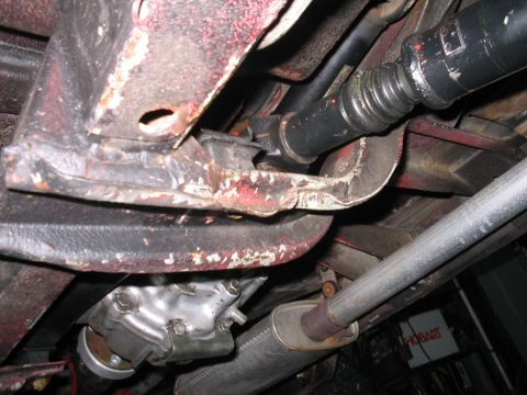 1987 Suzuki Samurai - Underside view shows drivetrain components including driveshaft and exhaust system.