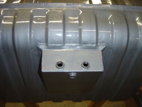 1978 Ford Bronco - This image shows a close-up view of a vehicle's fuel tank, likely undergoing maintenance or restoration.