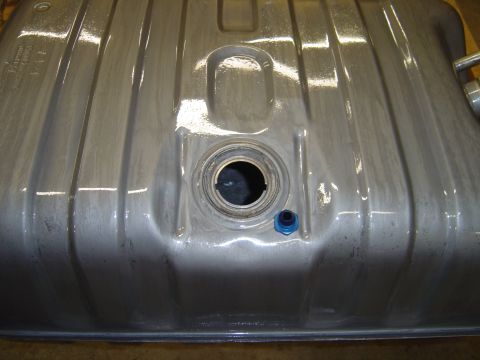1978 Ford Bronco - A metal fuel tank with a ribbed exterior and a central opening for the filler neck is shown.