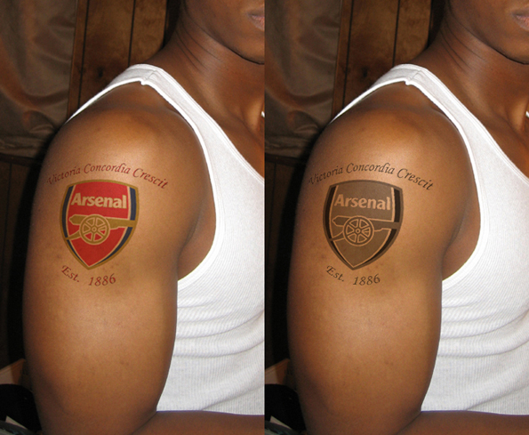Tattoo of Arsenal crest and 'Est. 1886' on arm