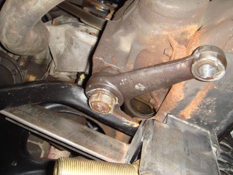 1996 Ford Bronco - A close-up view of a worn steering linkage component, showing signs of rust and age.