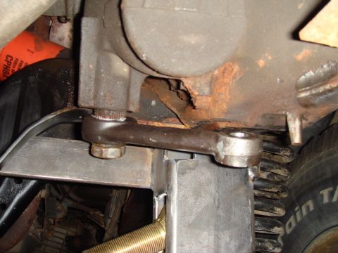 1996 Ford Bronco - Undercarriage view shows a steering linkage connected to a suspension spring.