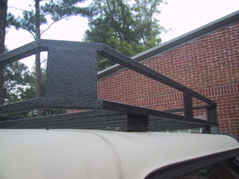 1995 Ford Bronco - Close-up of a black roof rack installed on a vehicle's roof.
