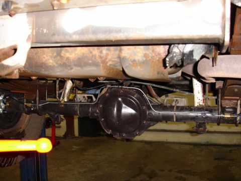 1996 Ford Bronco - Underside view of a vehicle's rear axle and suspension system.