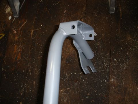 1996 Ford Bronco - A close-up view of a painted metal component, likely a part of a vehicle's structure or accessory.