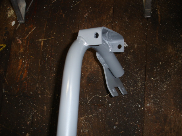 Painted metal part with mounting brackets