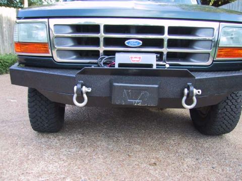 1995 Ford Bronco - Front view of a 1995 Ford Bronco a heavy-duty winch bumper and a WARN winch mounted behind the grille.