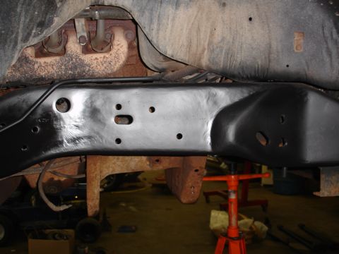 1996 Ford Bronco - Close-up view of a vehicle's undercarriage, showing the frame and exhaust components.