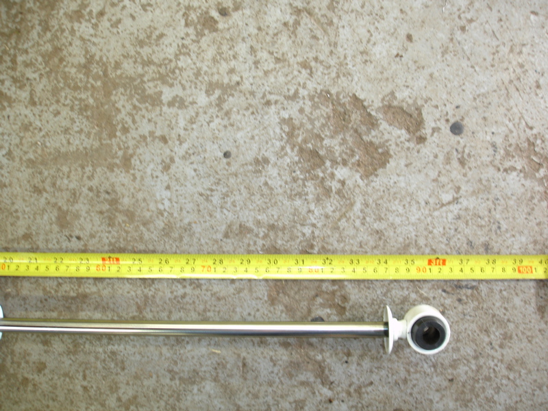 metal rod with rubber end, next to a yellow measuring tape showing inches and centimeters
