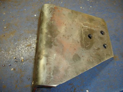 1996 Ford Bronco - Metal bracket with four bolt holes, likely a replacement part for a vehicle.