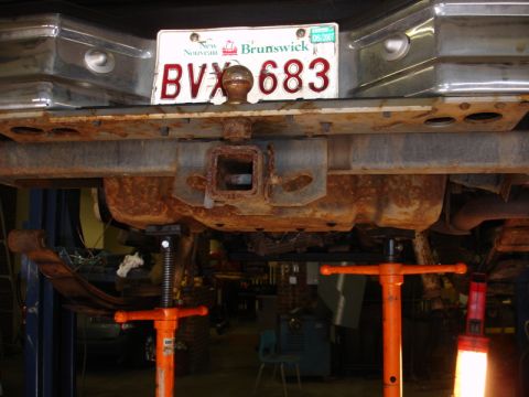 1996 Ford Bronco - The rear bumper and trailer hitch assembly are heavily rusted, with a New Brunswick license plate visible.