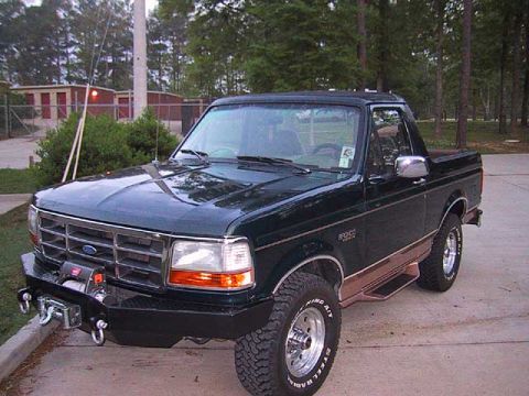 1995 Ford Bronco - This Ford Bronco features a two-door configuration and an aftermarket front bumper with a winch.