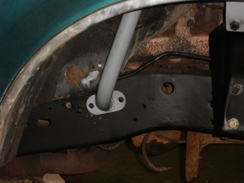 1996 Ford Bronco - Undercarriage view reveals suspension and frame details, with a pipe mounted to the chassis.