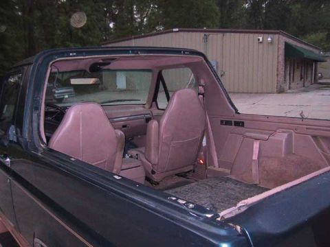 1995 Ford Bronco - Interior view of a 1995 Ford Bronco, highlighting the seating and dashboard.