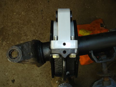 1996 Ford Bronco - Aftermarket suspension lift part installed on a vehicle axle.