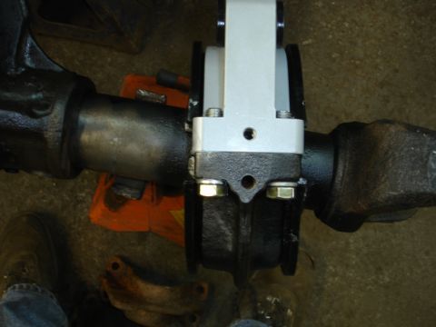 1996 Ford Bronco - A vehicle's axle assembly is shown with a newly installed component, likely for suspension or braking.