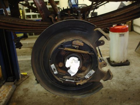 1996 Ford Bronco - Close-up of a vehicle's rear brake assembly during maintenance or repair.