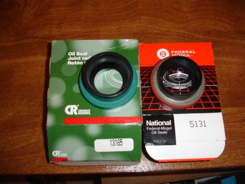 1996 Ford Bronco - Two oil seals are shown in their original packaging, one from CR Chicago Rawhide and the other from National Federal-Mogul.