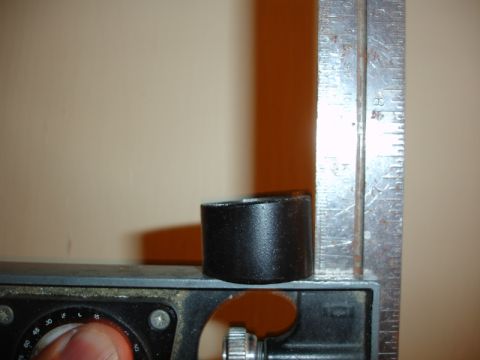 1996 Ford Bronco - A black cylindrical part is shown next to a metal ruler, indicating its dimensions.