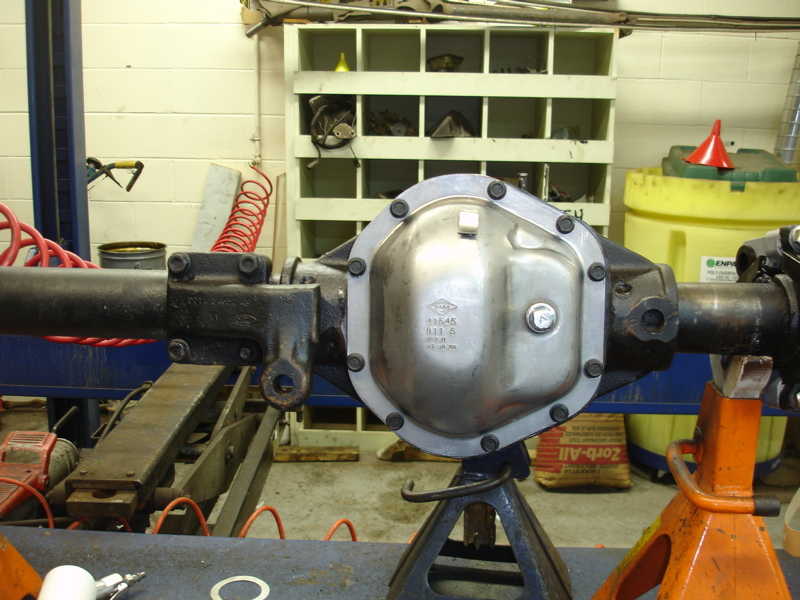 close-up of a rear axle differential cover with part numbers visible
